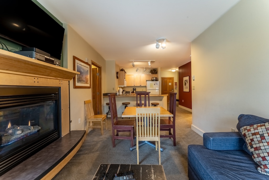 Living area offering a gas fire-place and cozy furnishings.