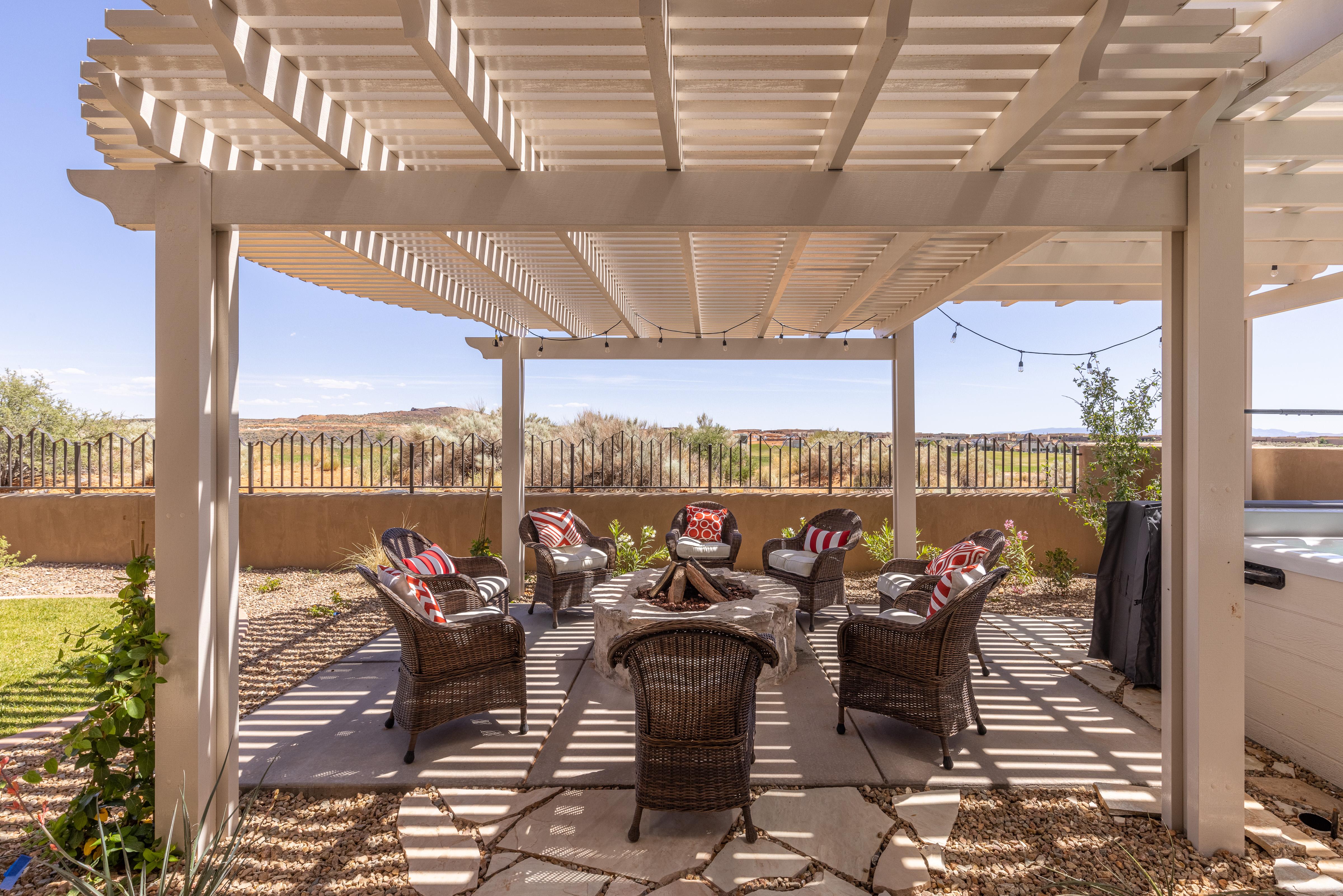Enjoy the weather under the pergola while sitting in our comfortable patio furniture.