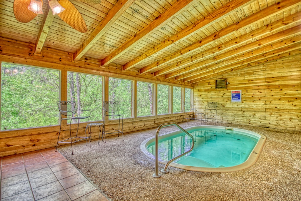 Professionally cleaned, private indoor heated pool. This cabin has it all including luxury furnishings, premium sleeper sofa, bunk beds, PacMan arcade game, pool table, King bed suites, 2 mile proximity to Pigeon Forge Parkway & Dollywood, plus wifi intern