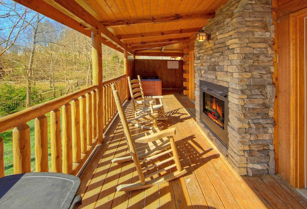 Two-sided gas fireplace! Great for evenings on your wrap-around porch at Gone Swimmin! Book your fantastic vacation today!