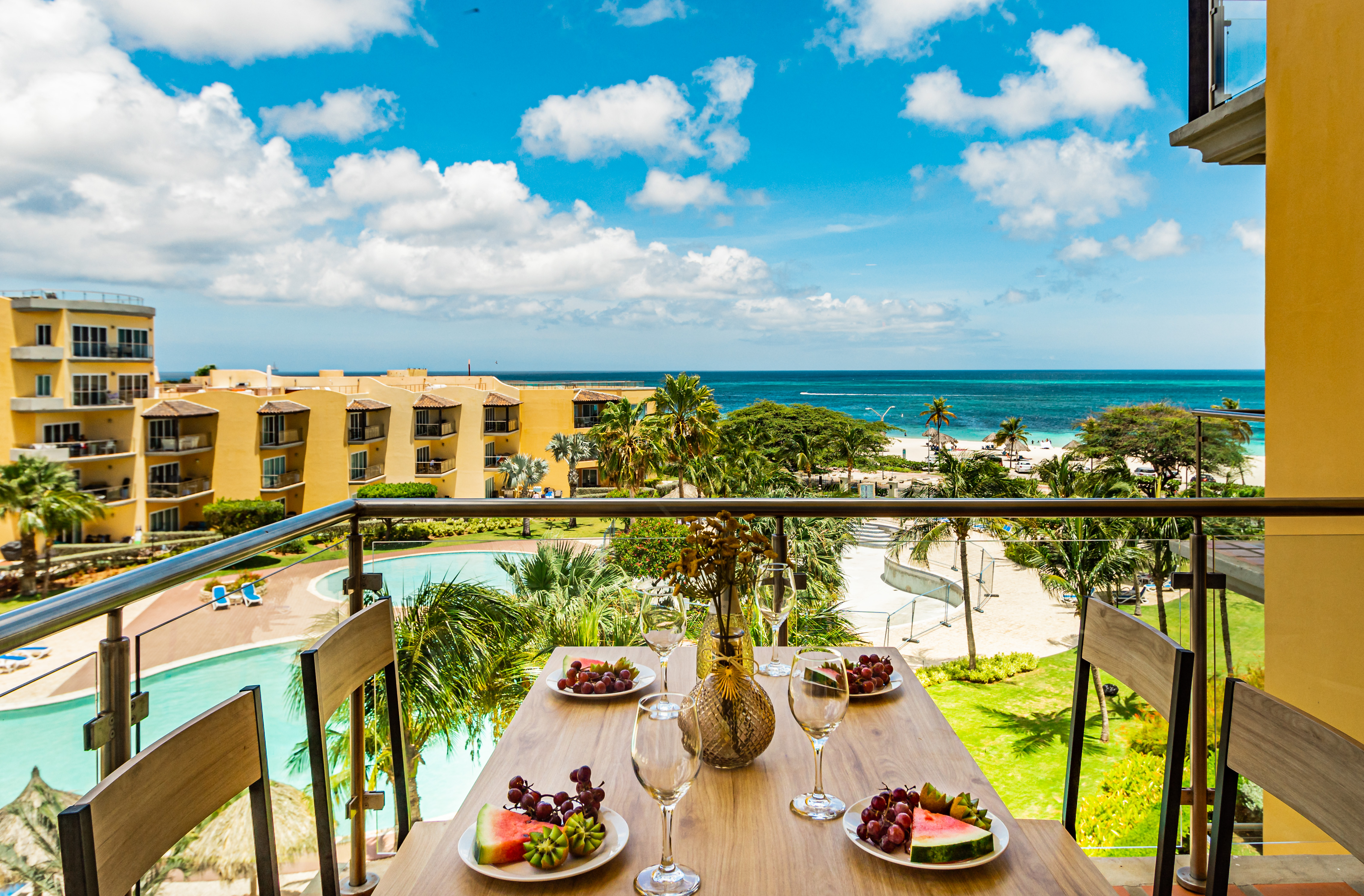Opulent Balcony of the Apartment in Aruba with ocean views - Scenic private balcony for relaxation - Dining for 4 persons - Access to outdoor beauty from the comfort of home