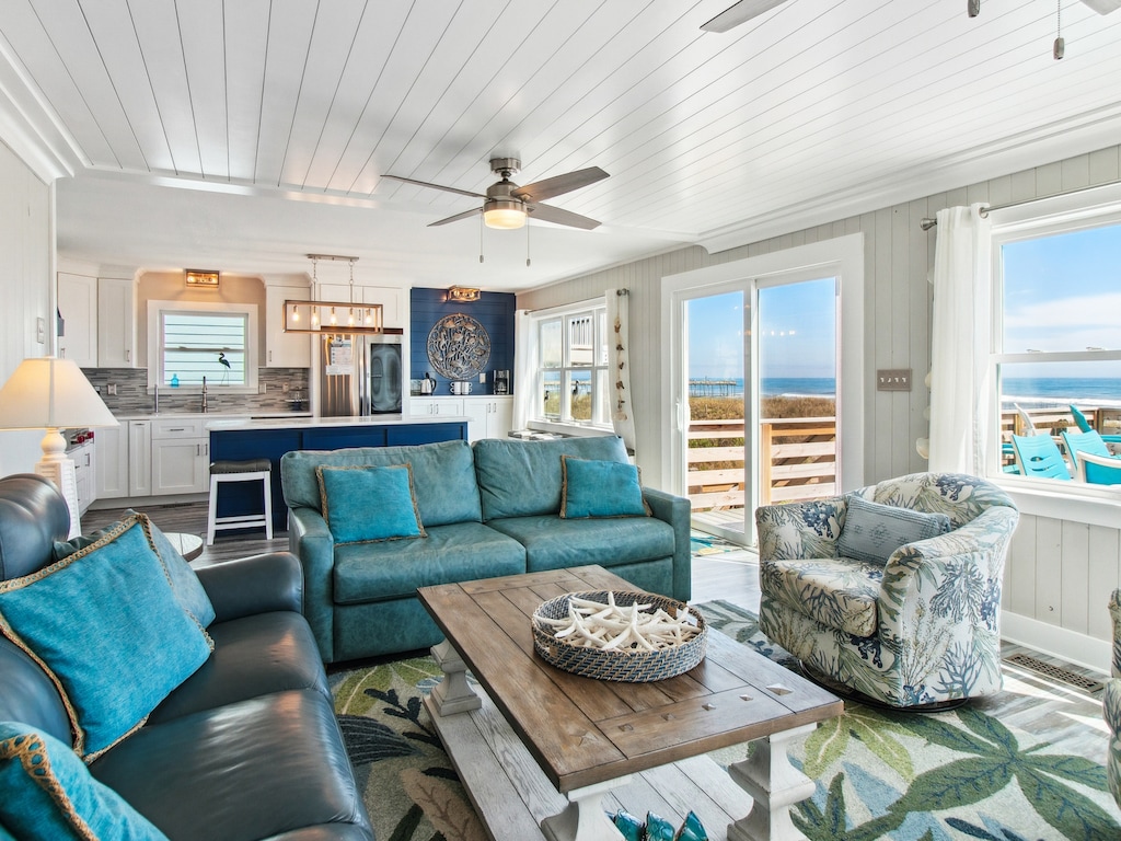 Stretch out on the comfortable furniture in the Living Area for family movie night in front of the Flat Screen TV as you enjoy the ocean views.