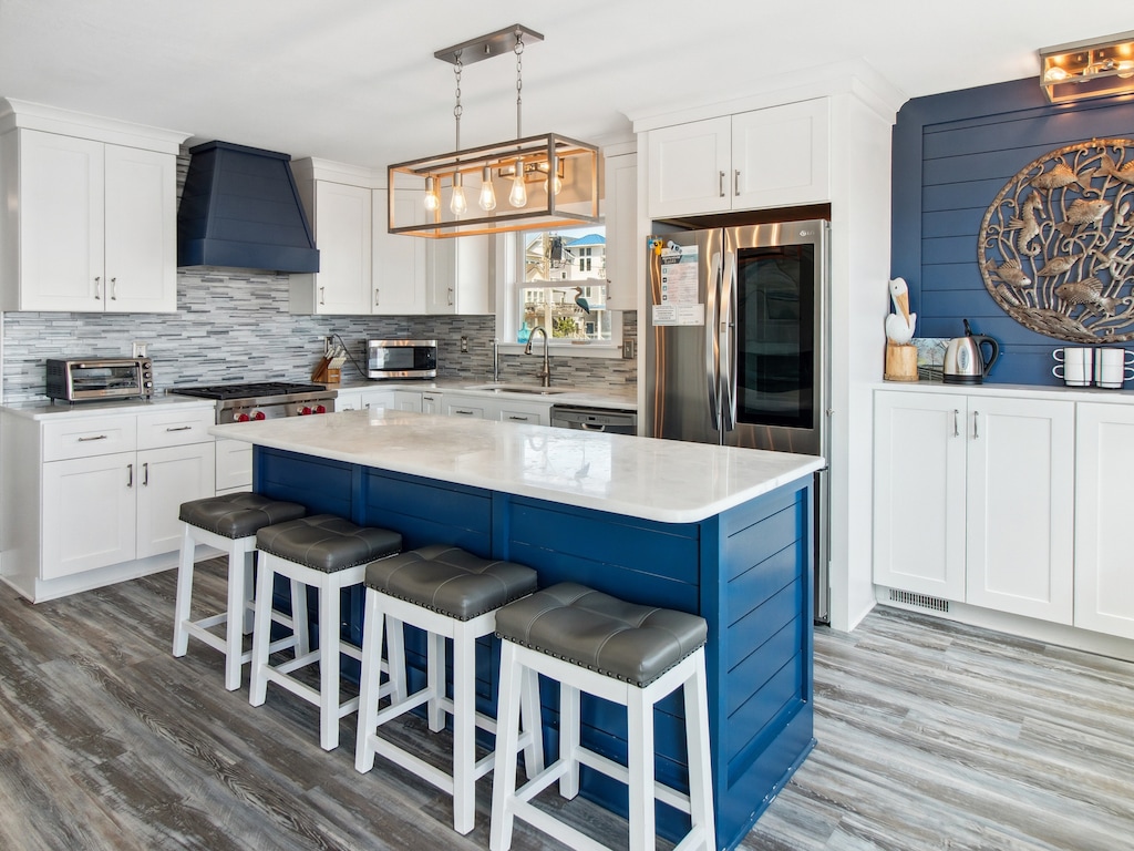 Whip up something delicious in the Gourmet Kitchen with luxurious Wolf appliances and a Convection Steam Oven that is perfect for preparing fresh, local Outer Banks seafood.