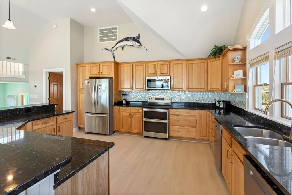 Cook up some fresh, local seafood in the open-concept Kitchen where 2 Dishwashers and a Wine Refrigerator await to help you make a spectacular meal that the whole family will enjoy.