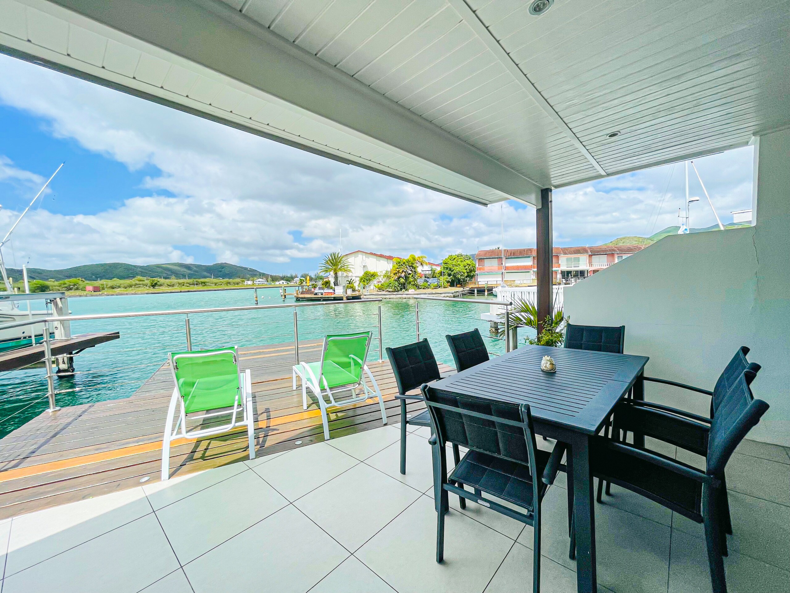 Stunning two-bed villa, extended decking, broad shaded verandah, with beautiful views over the water and Alfresco dining at Jolly Harbour villa rentals, Antigua