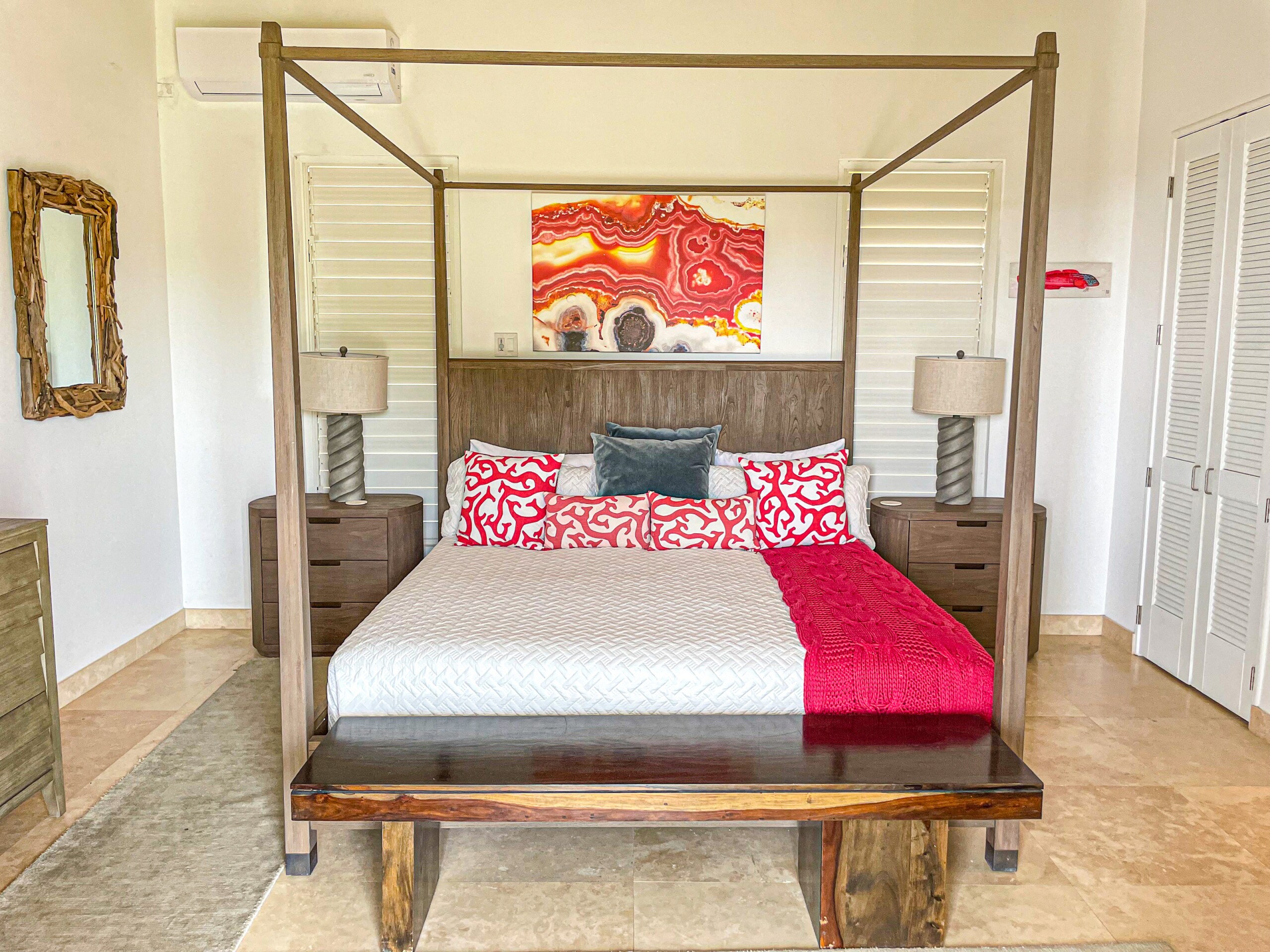 Charming three-bedroom villa with stunning natural, vaulted ceilings, ceiling fans, air-conditioning, duvets, and luxurious en-suite bathrooms with chic limestone and full body showers at Sugar Ridge Villa Rentals
