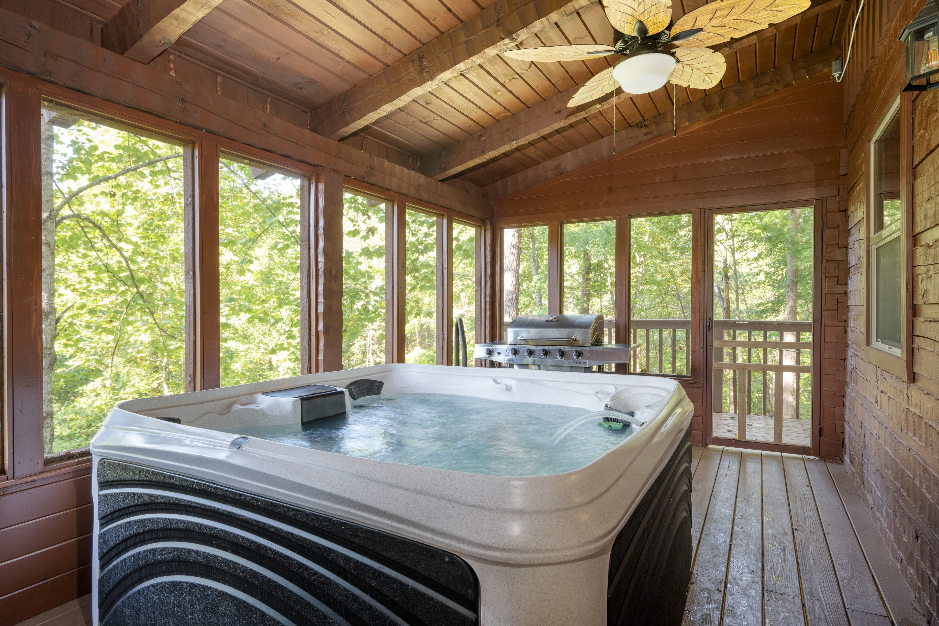 Luxurious hot tub on the enclosed patio.