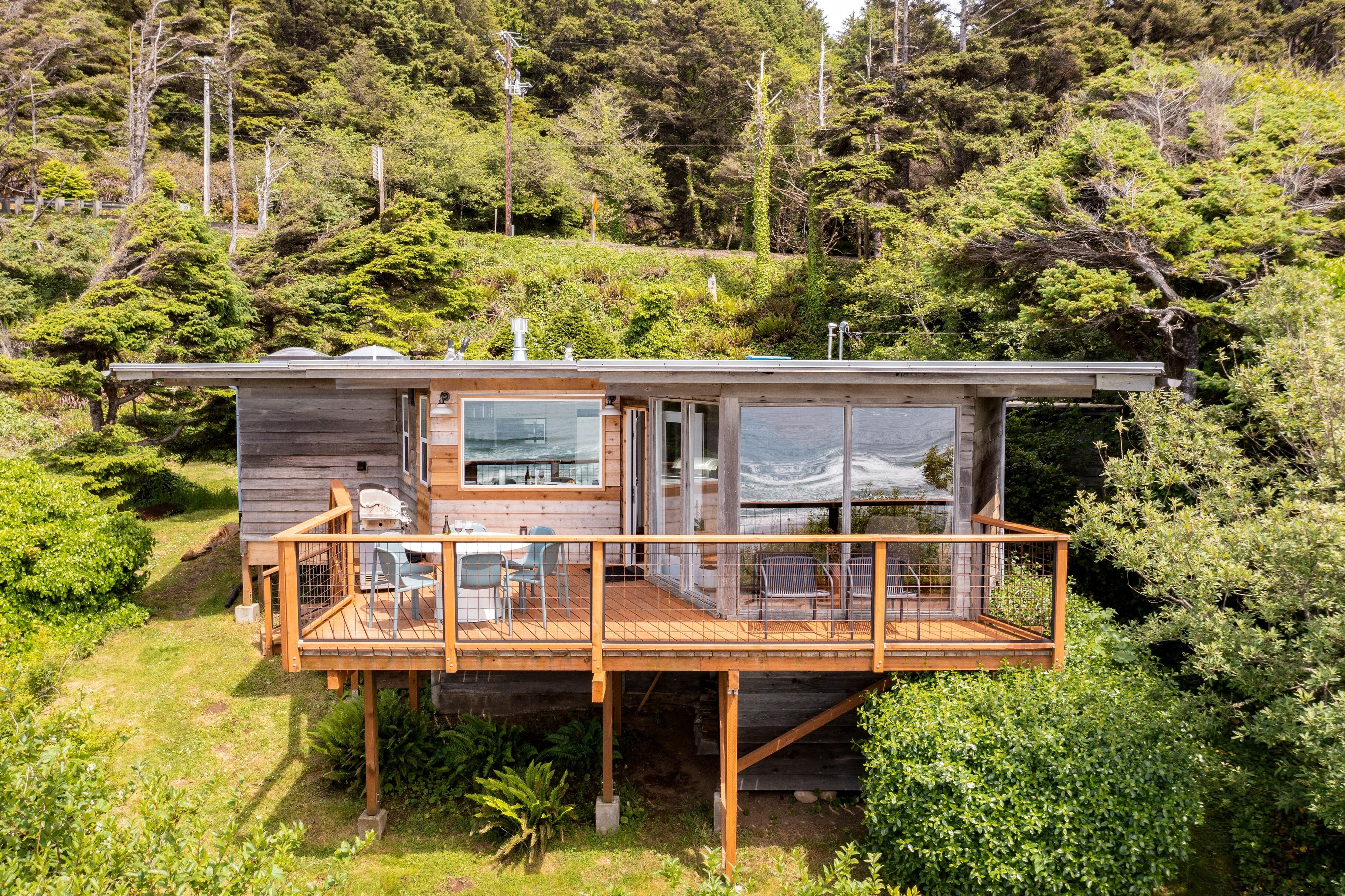 Perched on a hillside where the forest meets the sea.
