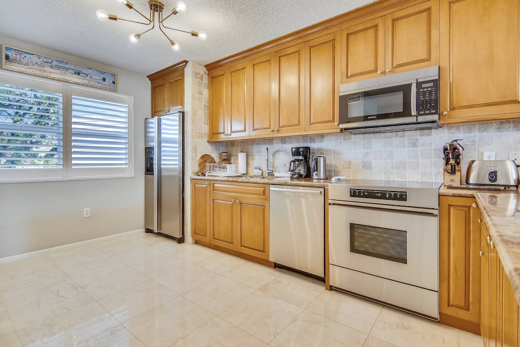 Spacious kitchen features modern appliances.