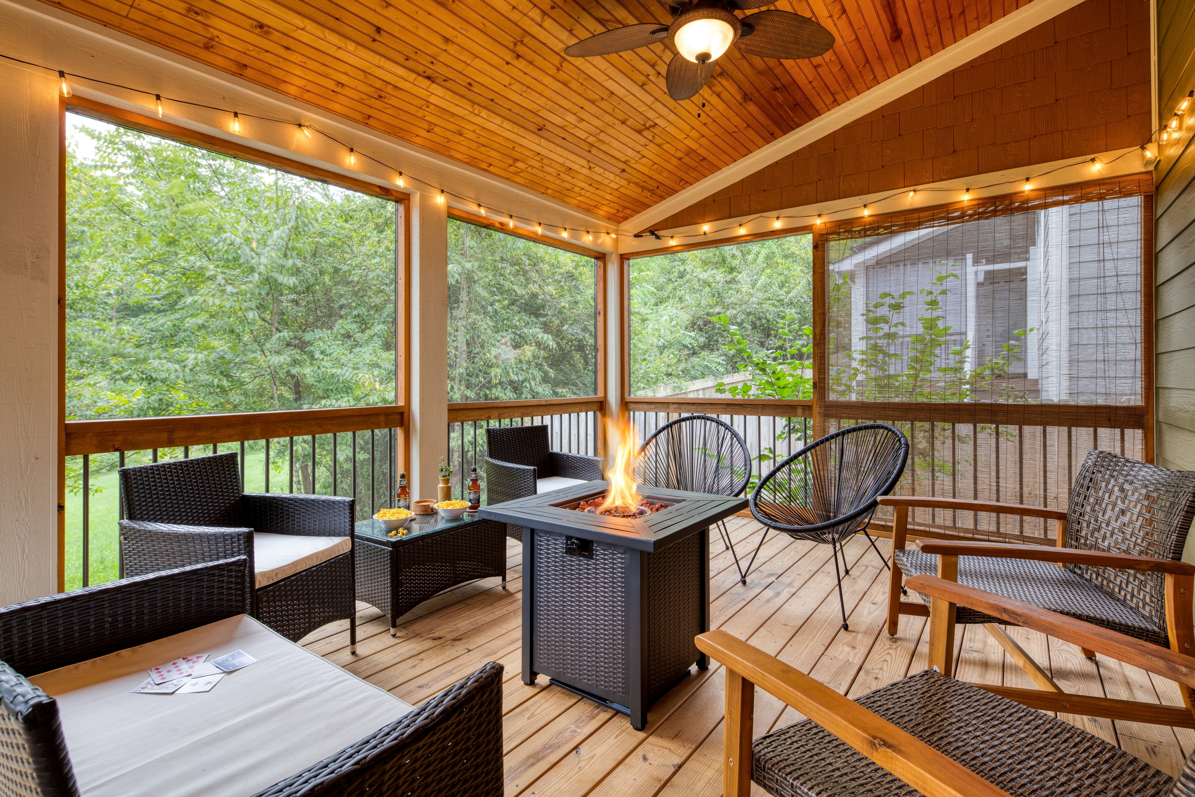 Spacious covered deck with a firepit and tons of seating.