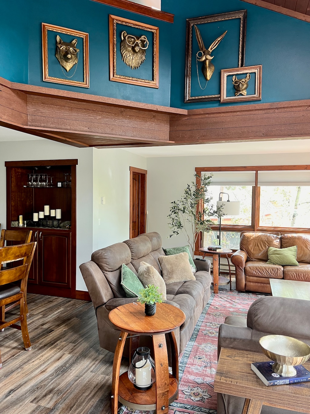 Radiant living area with vaulted ceilings, featuring a flat-screen TV, and gas fireplace. 