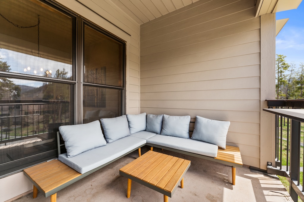 Private balcony with cozy outdoor seating.