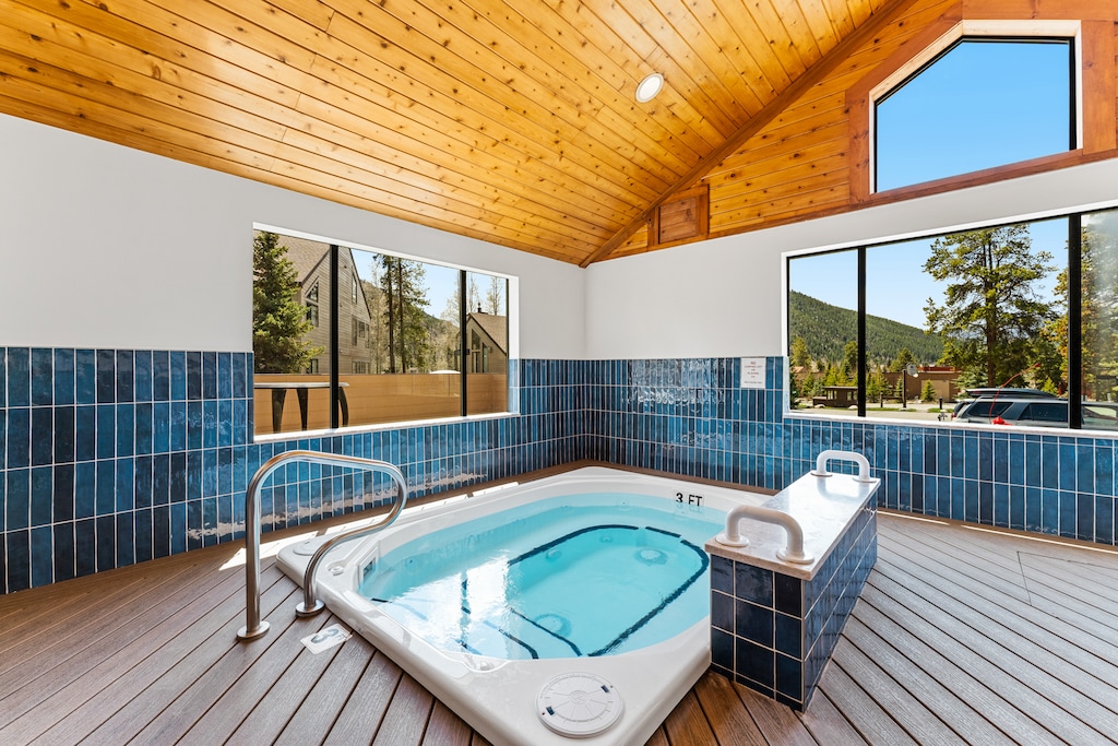 Newly remodeled pool house with a heated pool and hot tub. 
