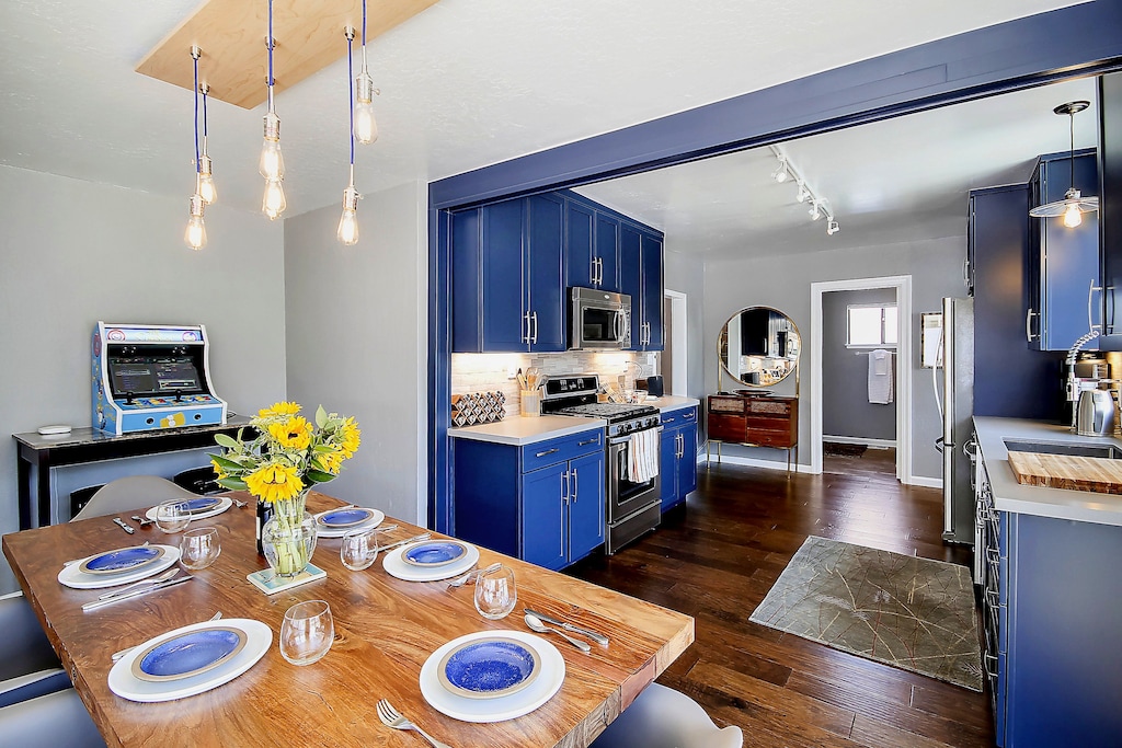 And the kitchen opens to the dining area and living room. The gaming console (a tiny sliver is visible in this photo) is no longer present.