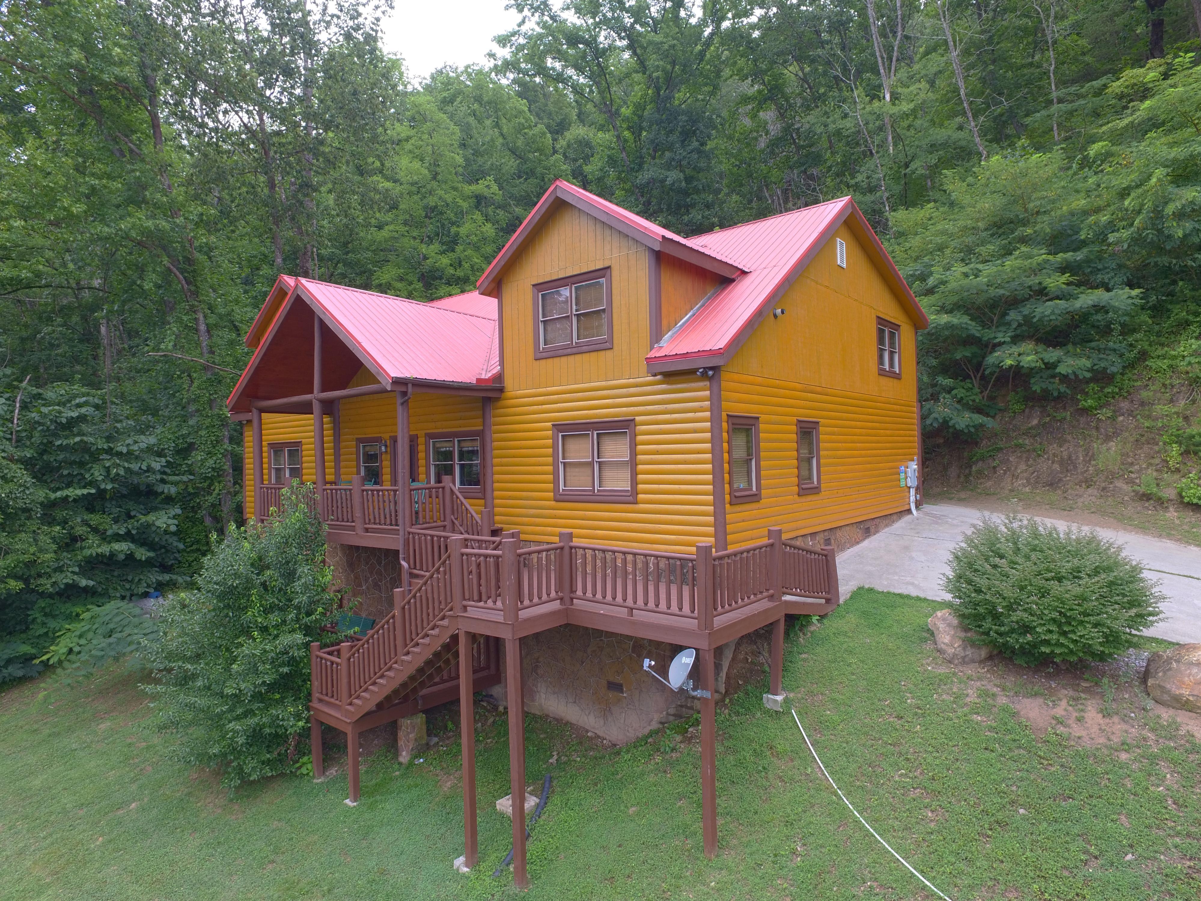 This large log cabin lodge is secluded with mountains views, private pool, video arcade game room, & so much more!