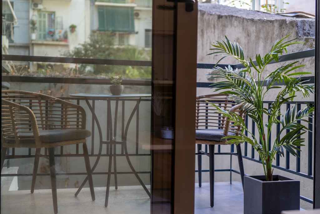 A cozy balcony to enjoy drinks or meals alfresco
