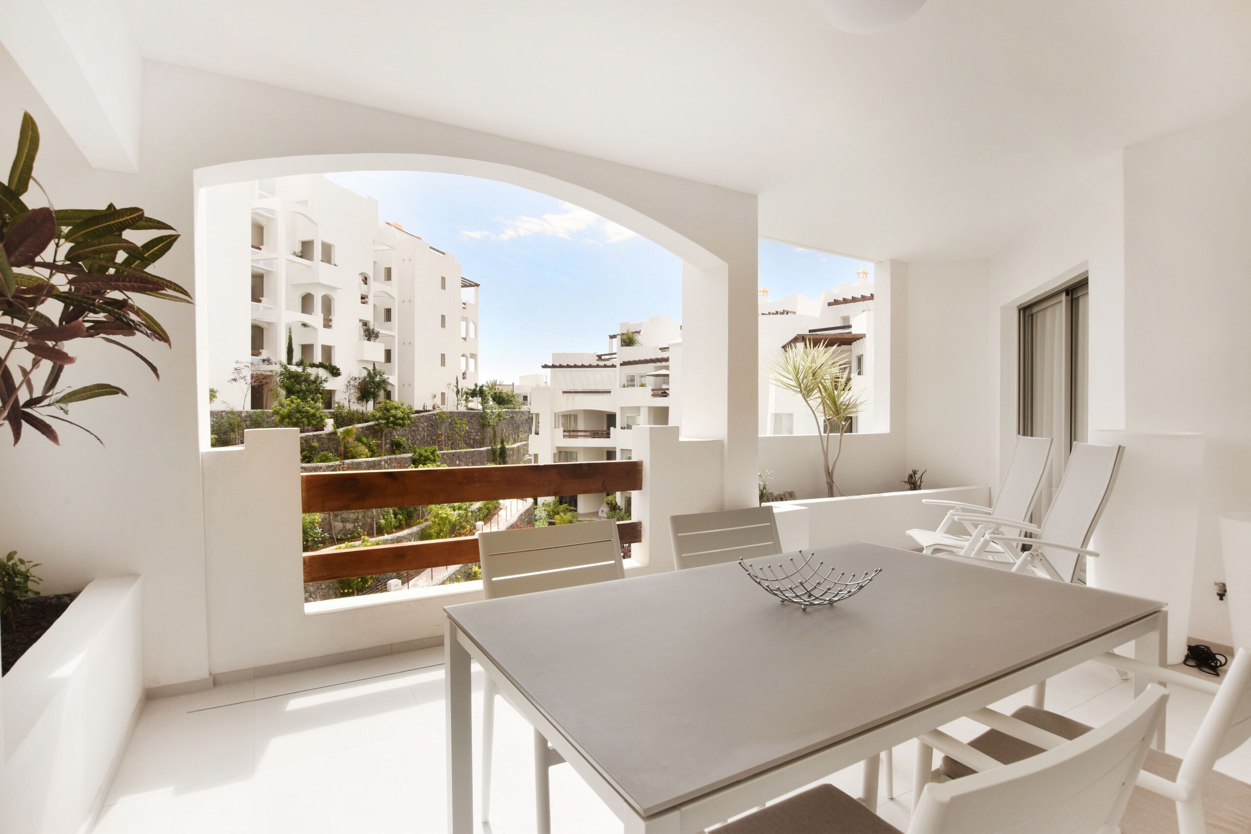 Large terrace with dining table and sunbathing area