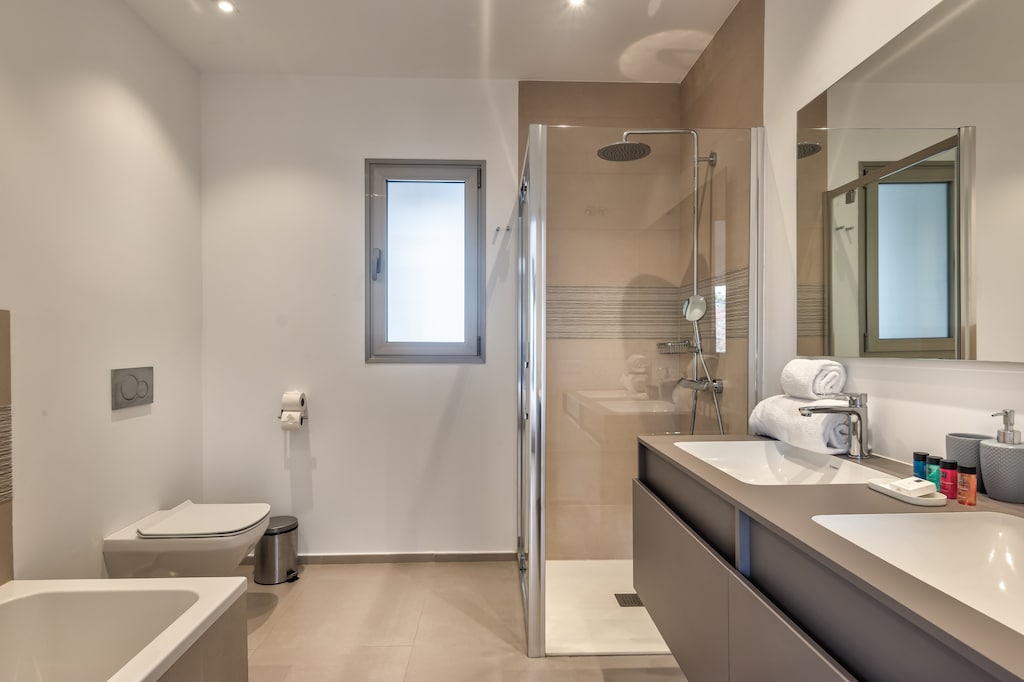 Bathroom with bathtub and shower