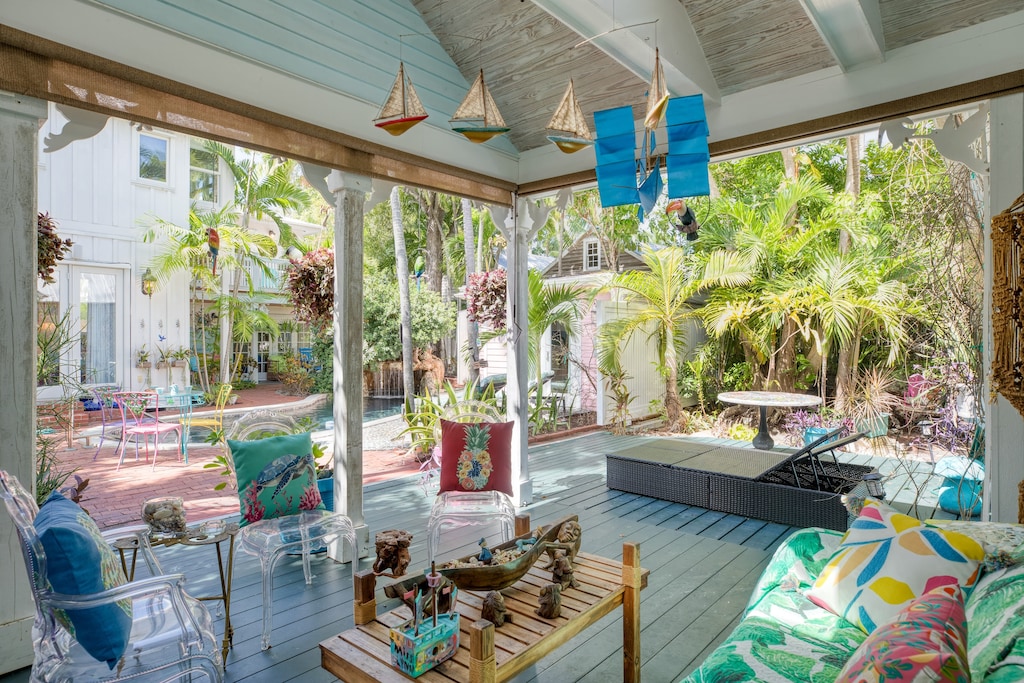 Covered outdoor lounge area with tons of comfortable seating.