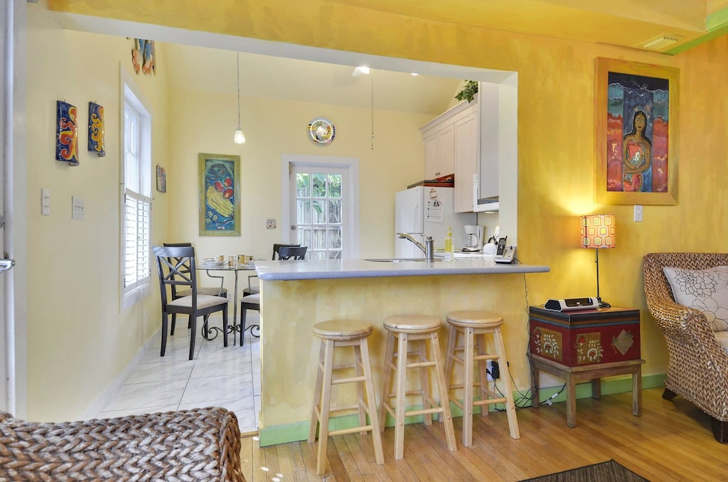 Kitchen features a breakfast bar with countertop seating.