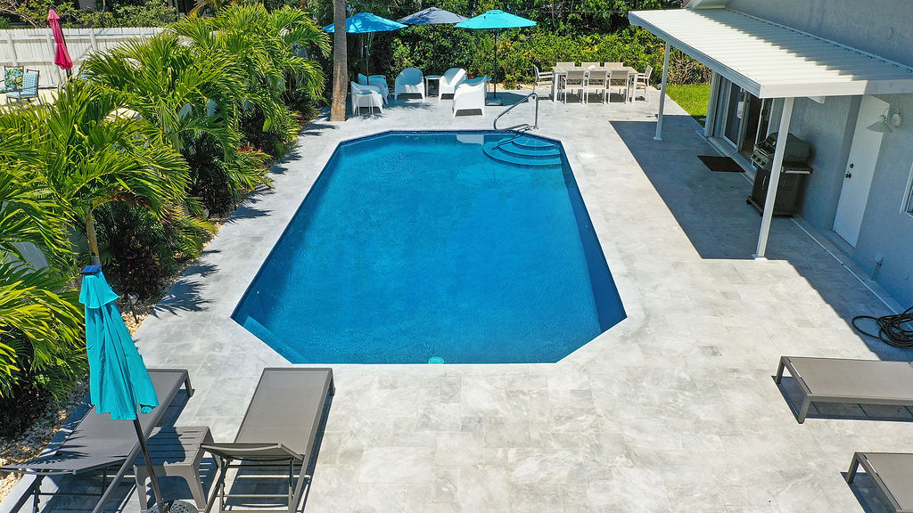 Outdoor seating options, shades and a BBQ with all utensils, make this garden hard to leave.