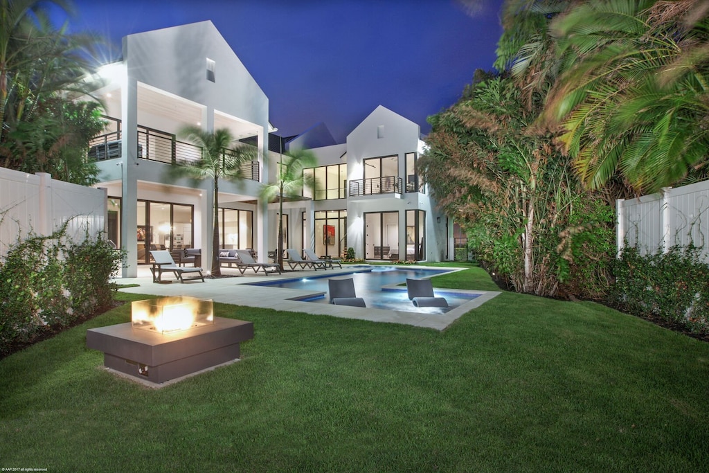 Evening time this home comes alive, enjoy the fire pit and swim into the night with this heated pool