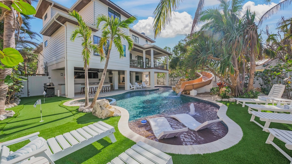 Rear Elevation - The Oasis - Covered Pool w/ Bar and Sunken Living Room