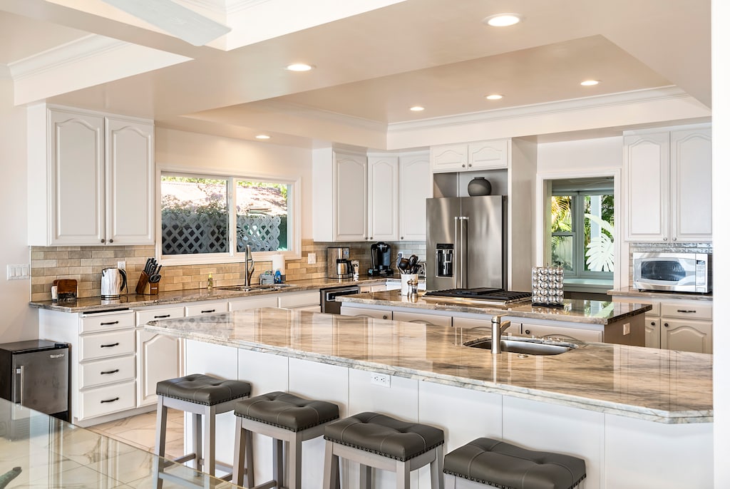 Gather around the stylish breakfast bar — perfect for casual dining or morning coffee chats.