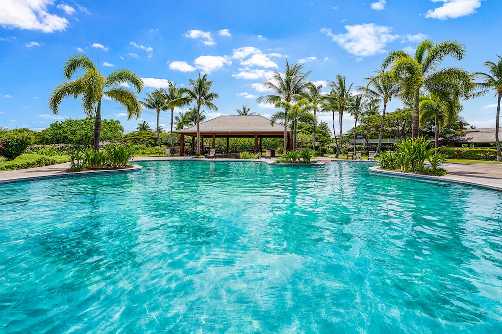 Take a relaxing dip, surrounded by swaying palm trees