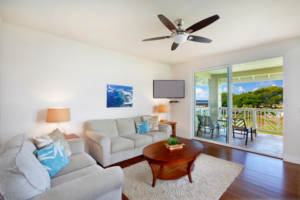 Unwind after a beach day in this cozy, light-filled living space.