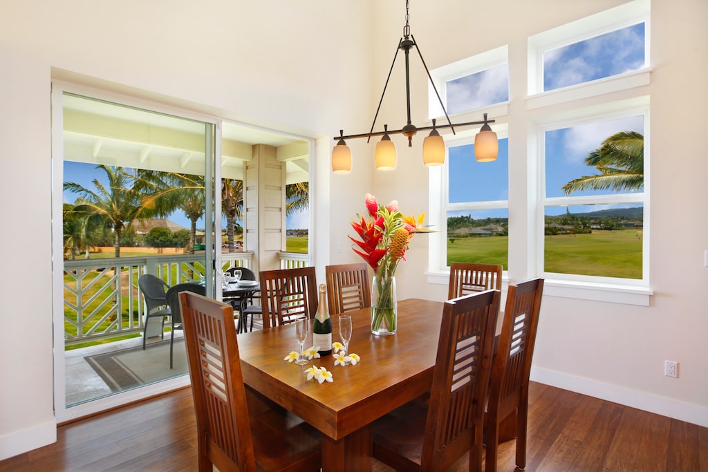 Dining Area for 6 with sunlit meals and tropical views.