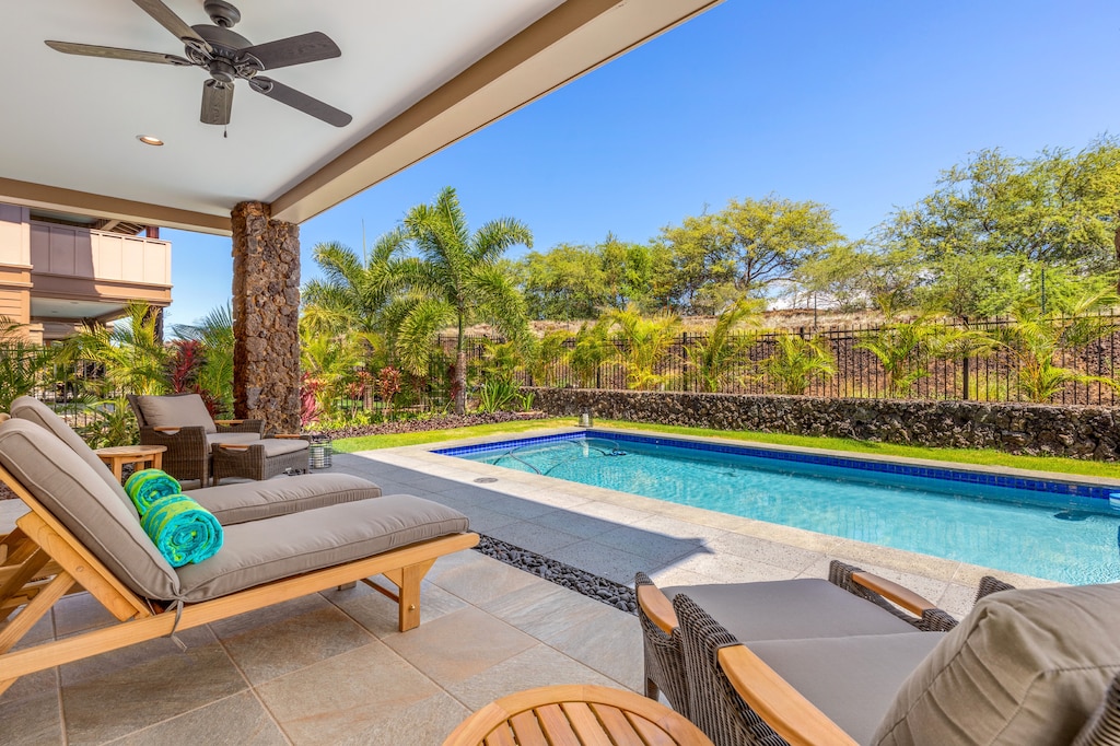 Alternate view of pool deck with plush seating.