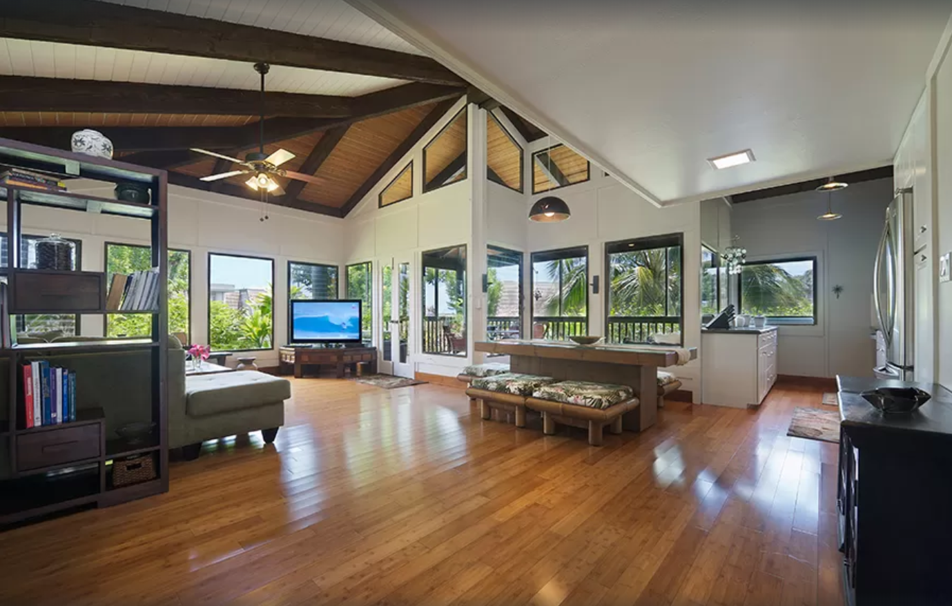 Open floor plan with vaulted ceilings in living room and kitchen