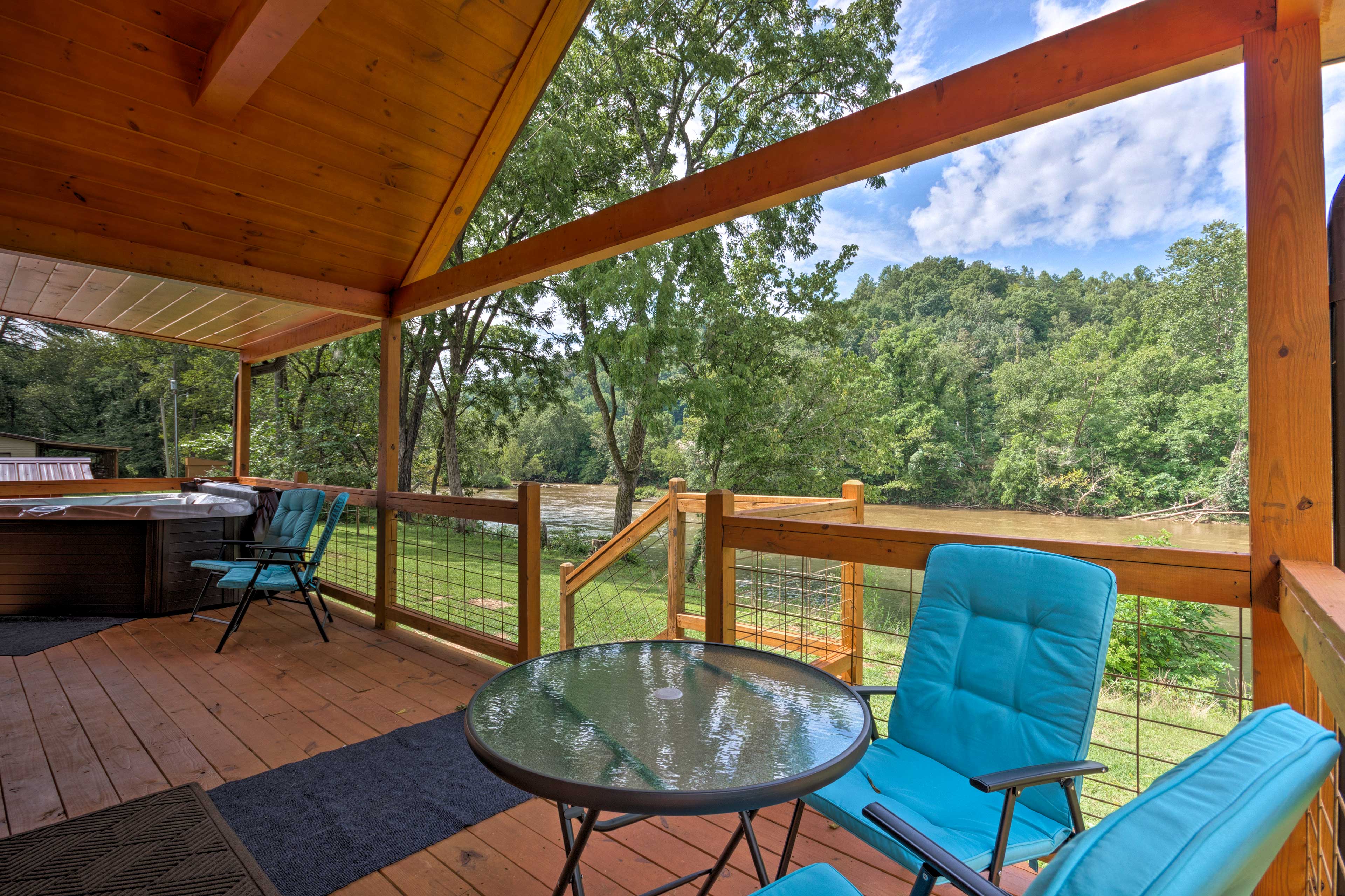 Property Image 2 - Charming Riverfront Cabin w/Private Deck & Hot Tub