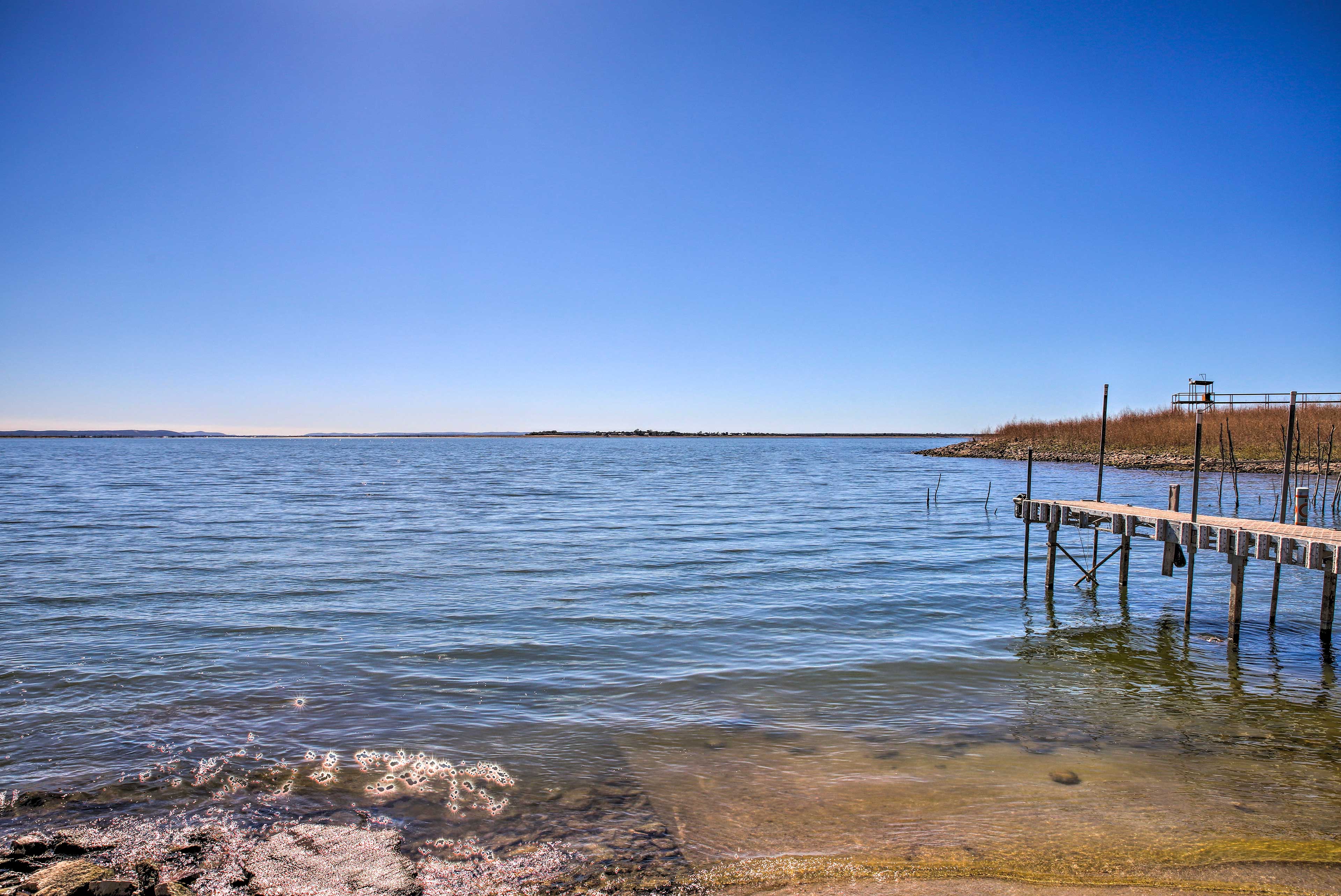 Sunny Lakefront Escape w/ Private Beach & Deck