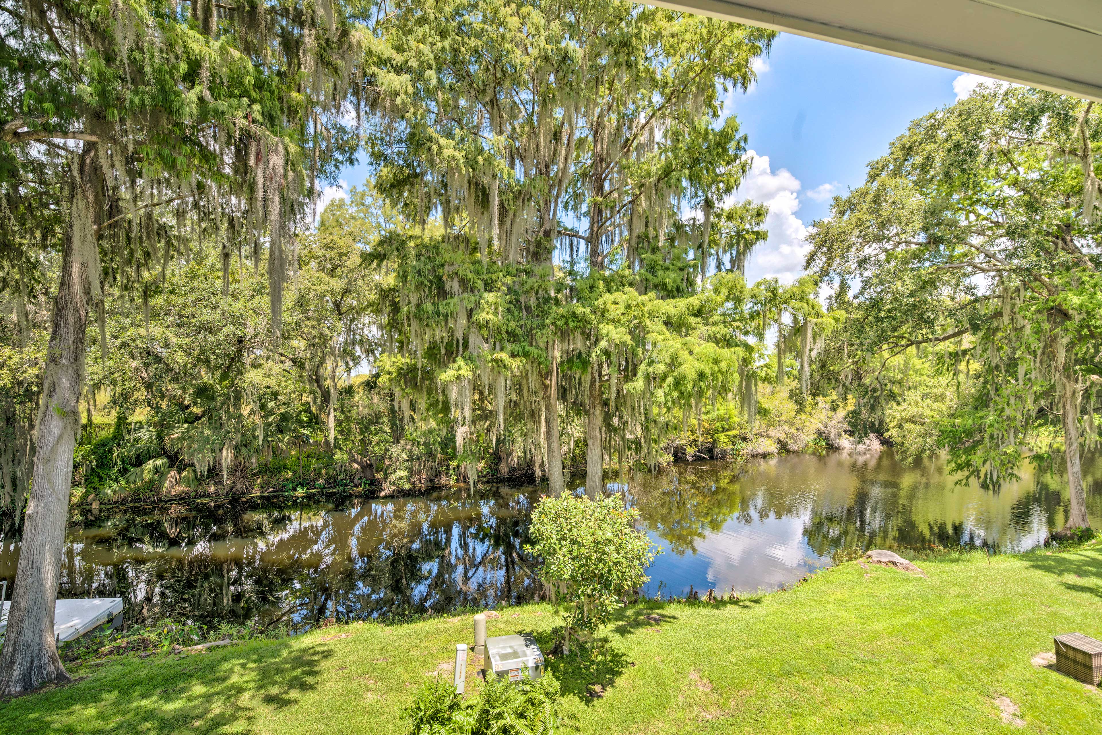 Old Florida Setting w/ Kayaks & Fishing Poles