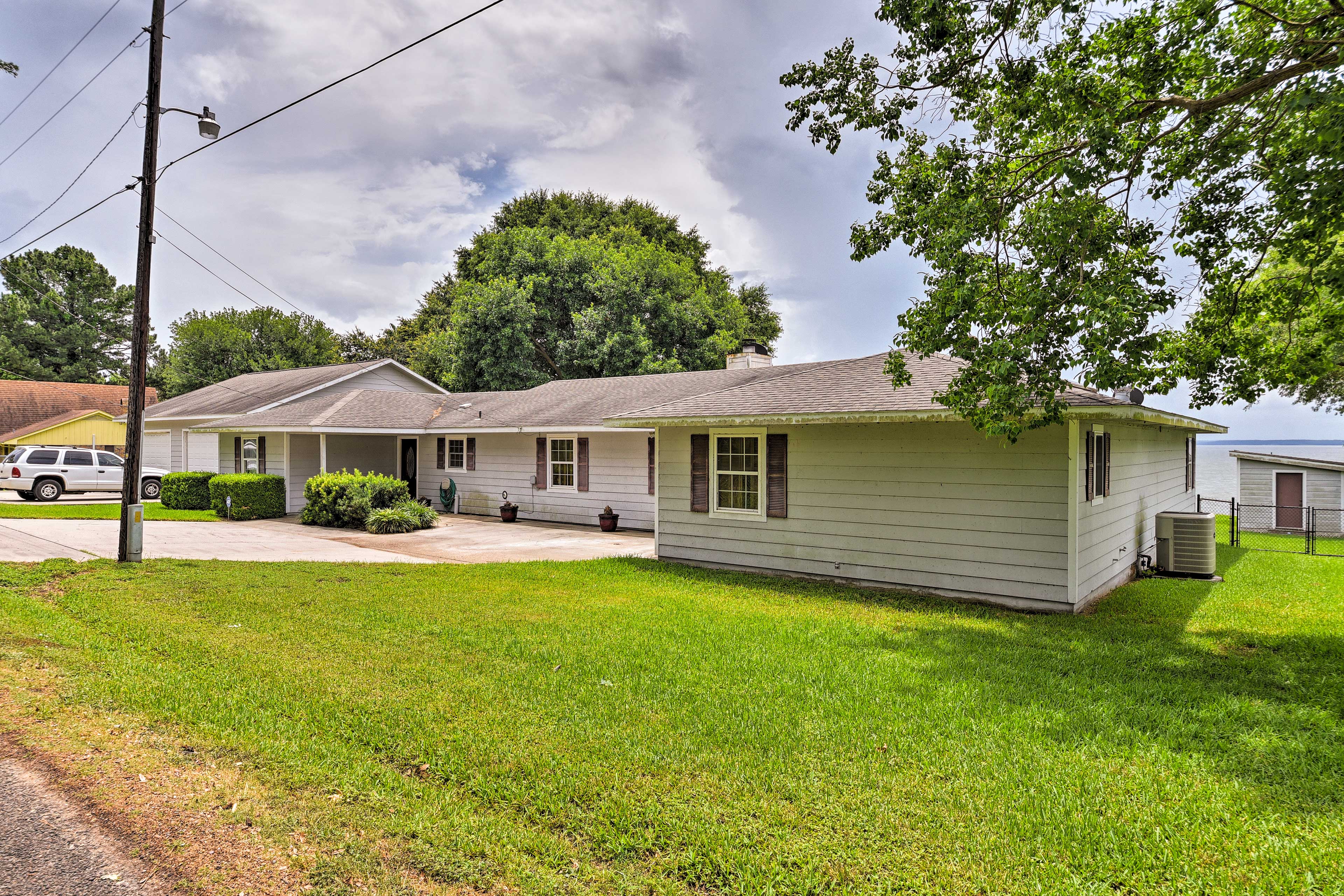 Property Image 1 - Lakefront Livingston Home w/ Dock, 1 Mi to Launch!