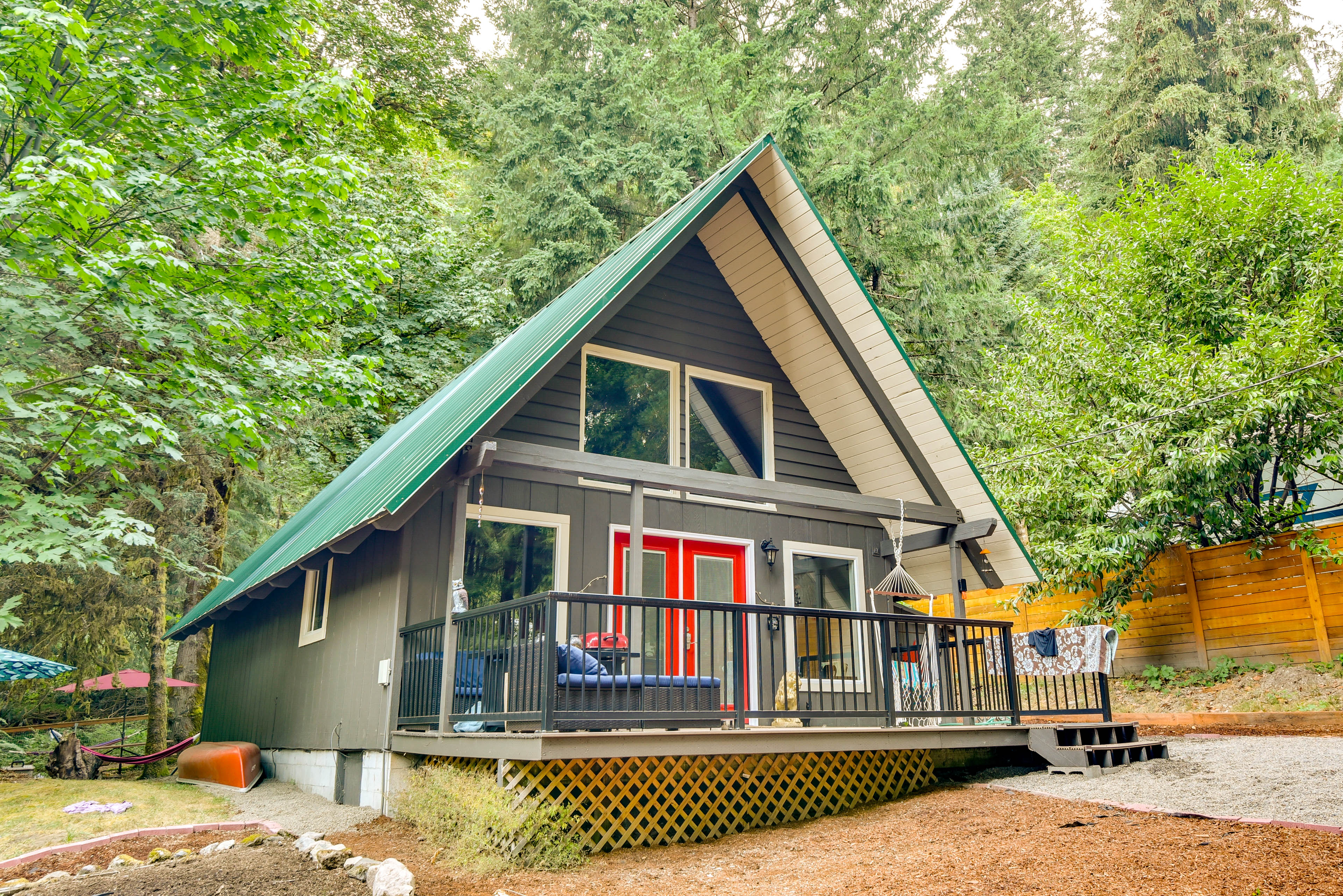 Property Image 2 - Rustic Cougar Cabin w/ Wood-Burning Fire Pit!