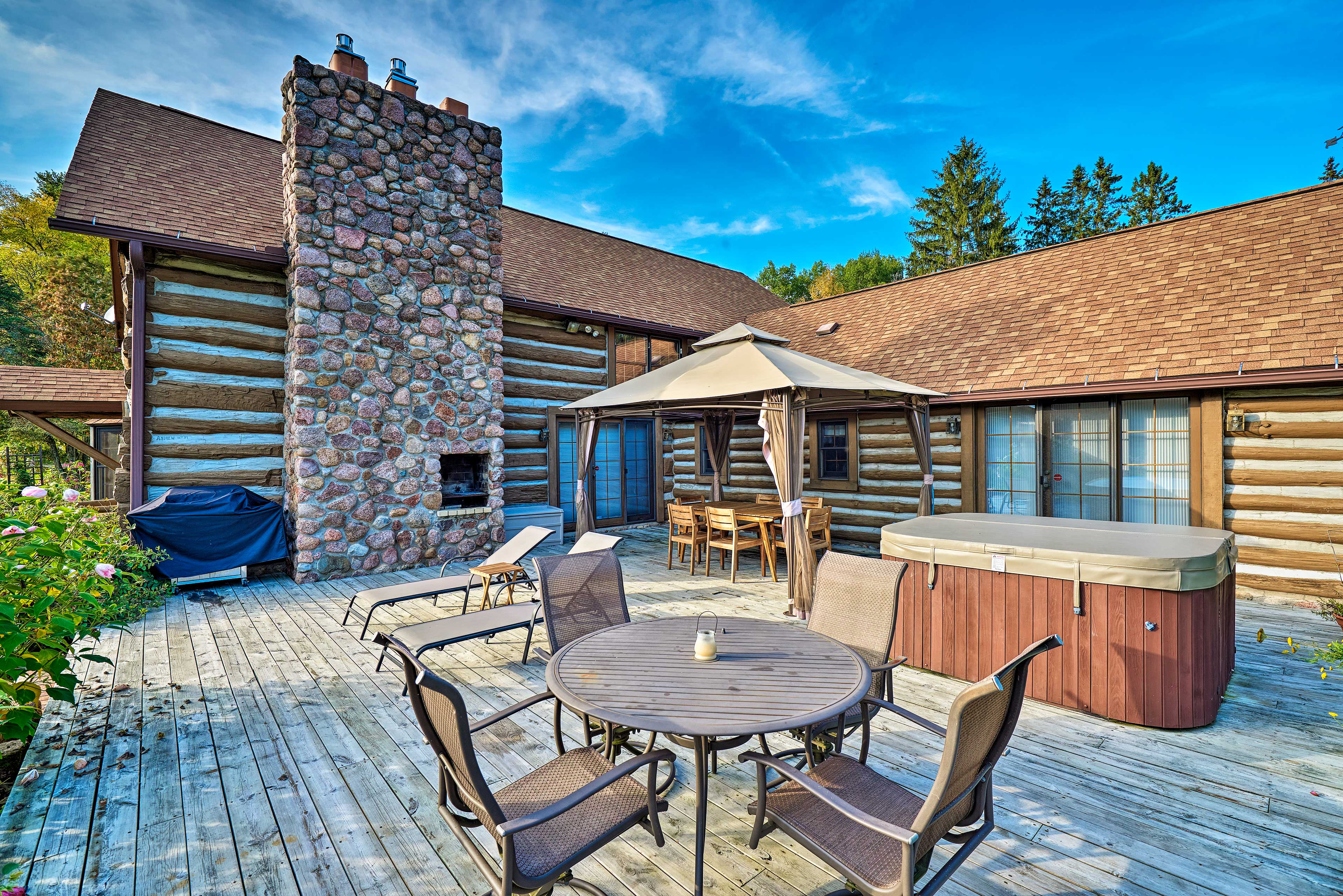 Property Image 2 - Log Cabin on the Wolf River w/ Private Hot Tub!