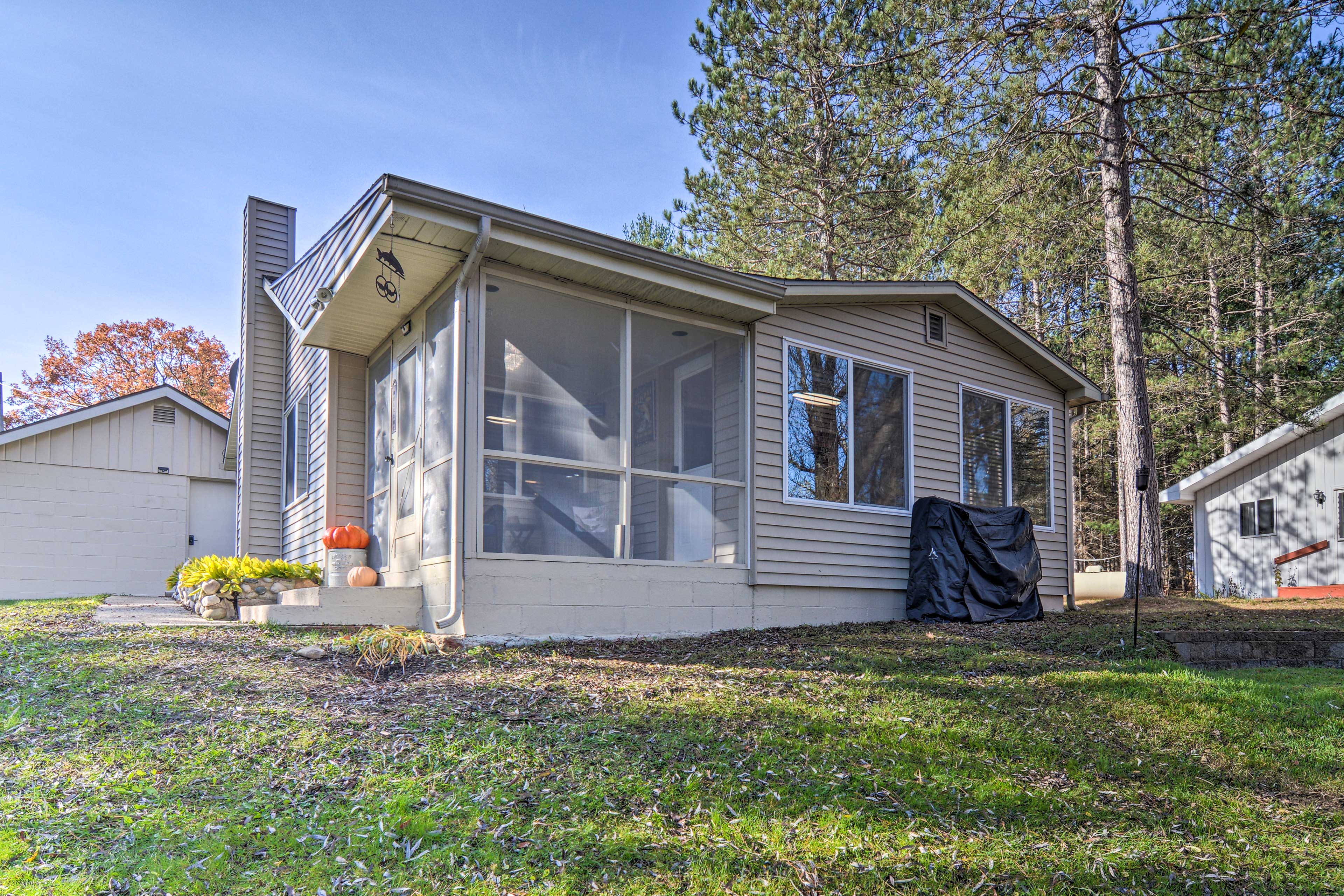 Property Image 1 - Riverfront Grayling Retreat w/ Fire Pit & Dock!