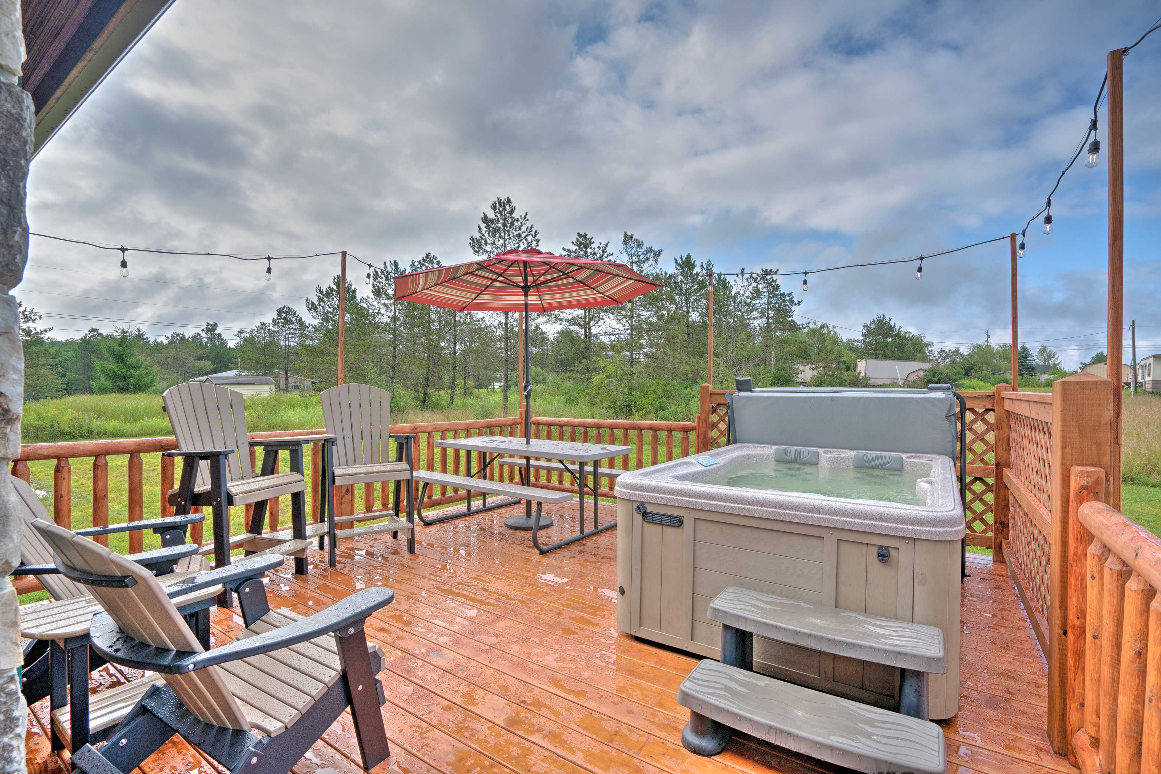 Property Image 1 - Rustic Benezette Cabin: Porch, Hot Tub & Fire Pit