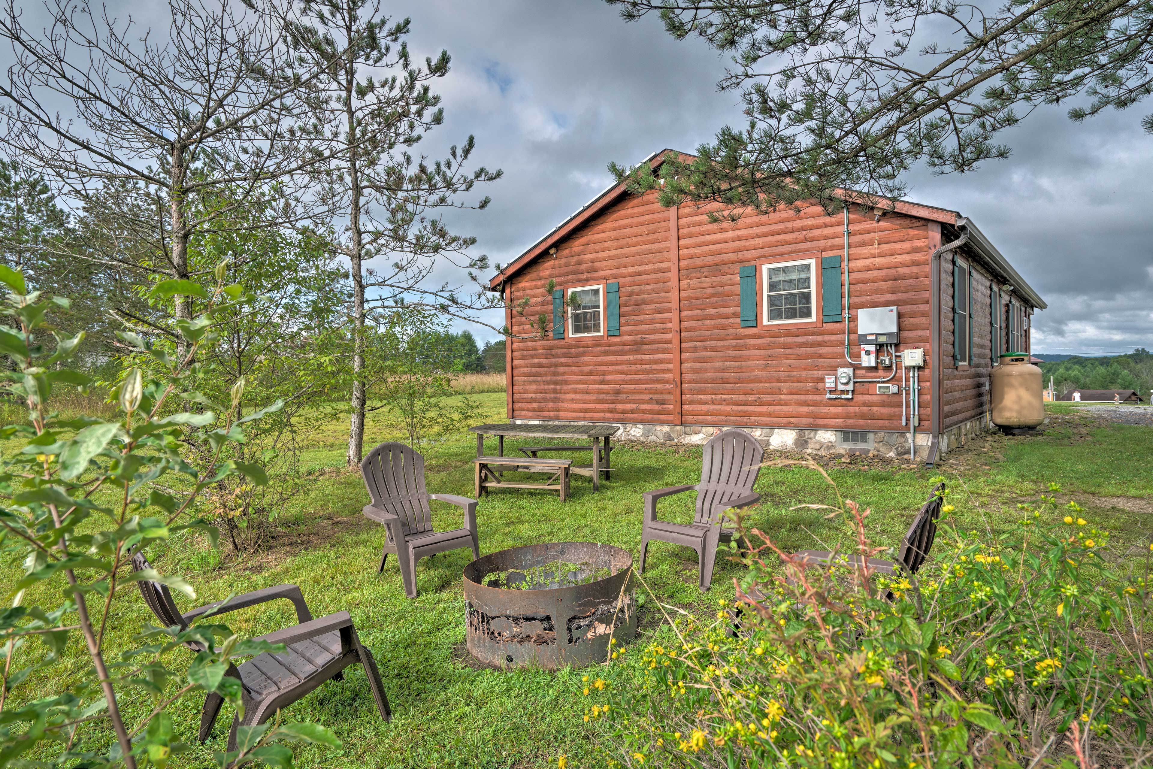 Property Image 2 - Rustic Benezette Cabin w/Porch, Hot Tub & Fire Pit