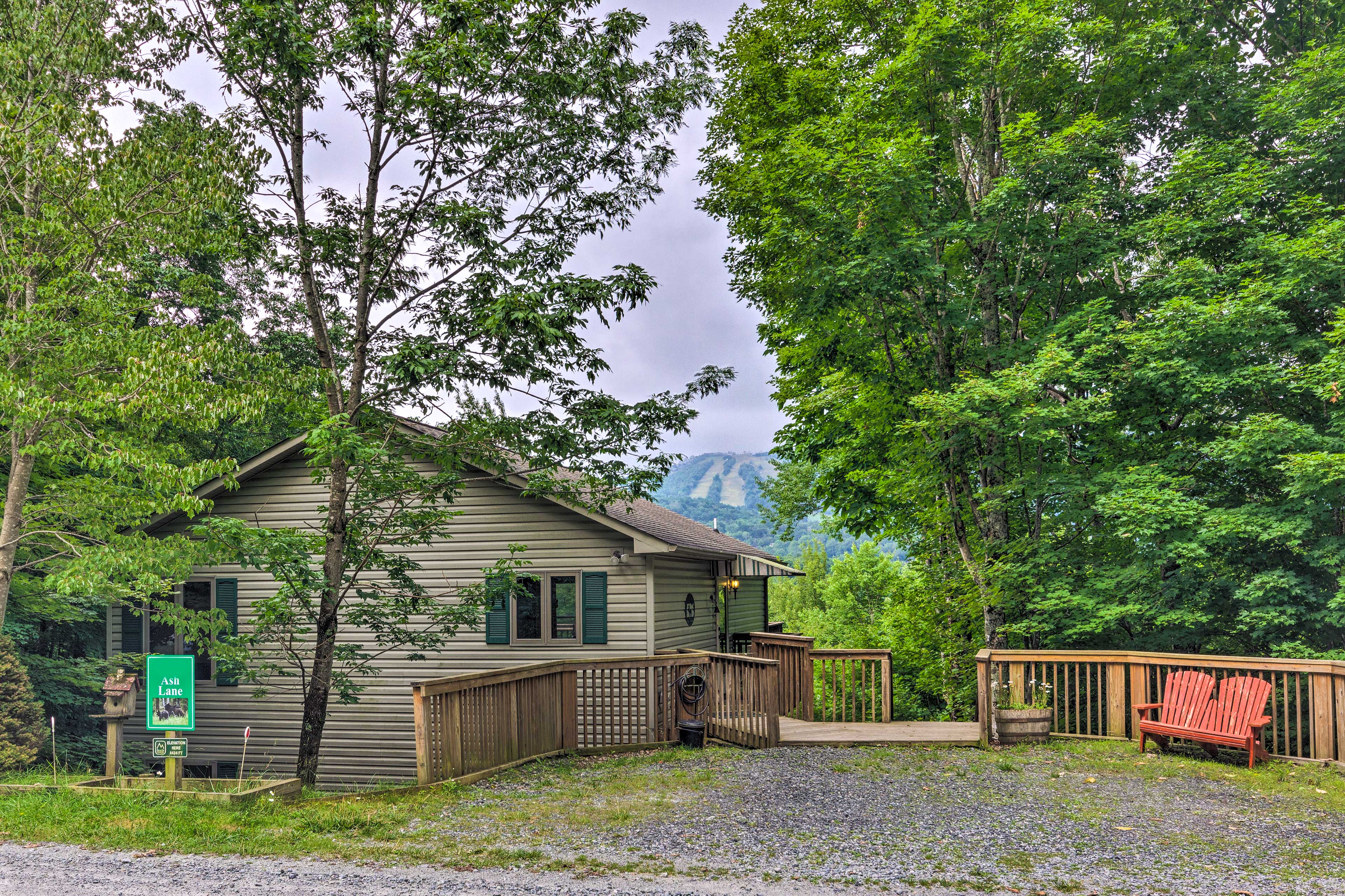 Property Image 1 - Warm Wooded Cabin w/ 2-Story Deck + Mountain View!