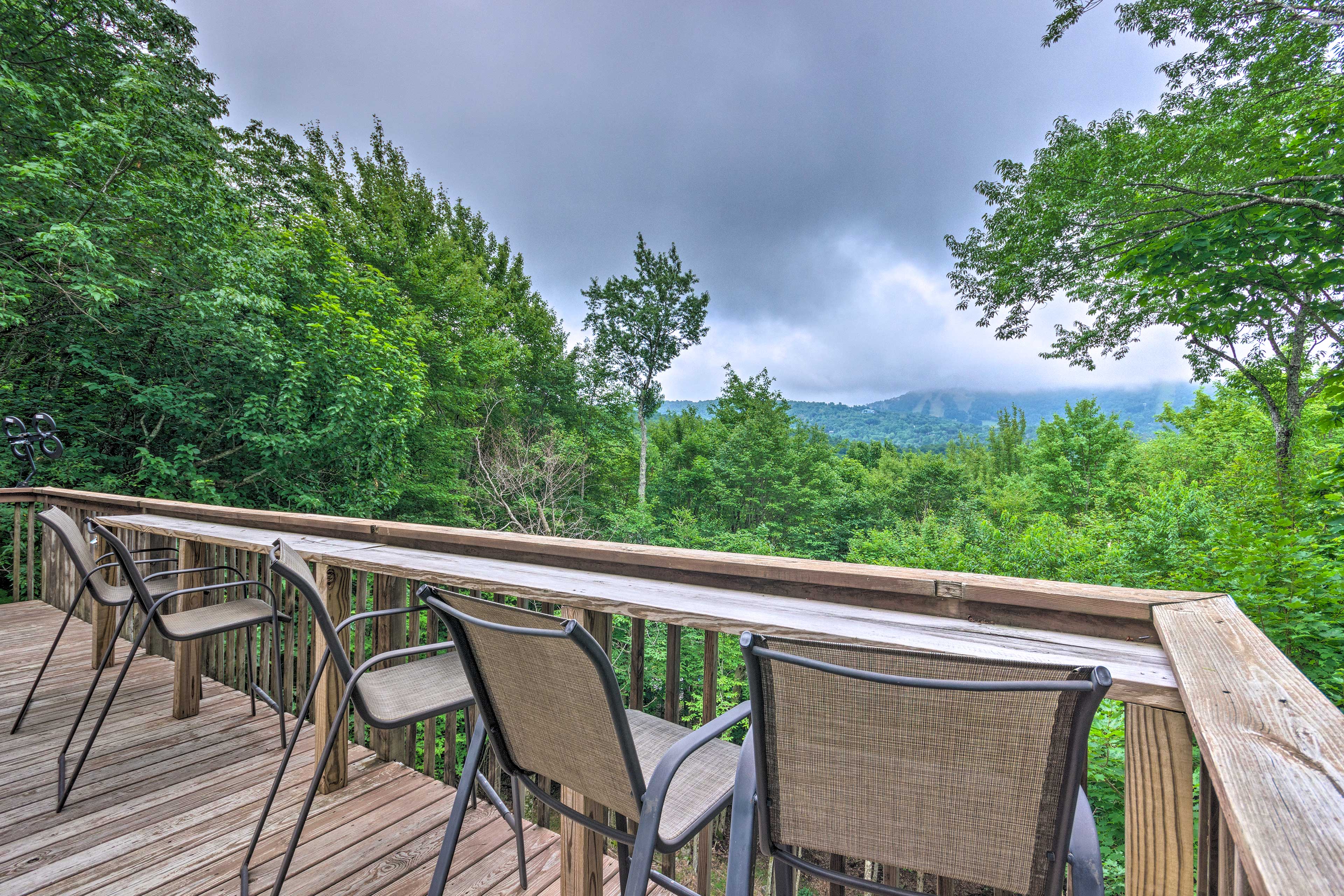 Property Image 2 - Warm Wooded Cabin w/ 2-Story Deck + Mountain View!