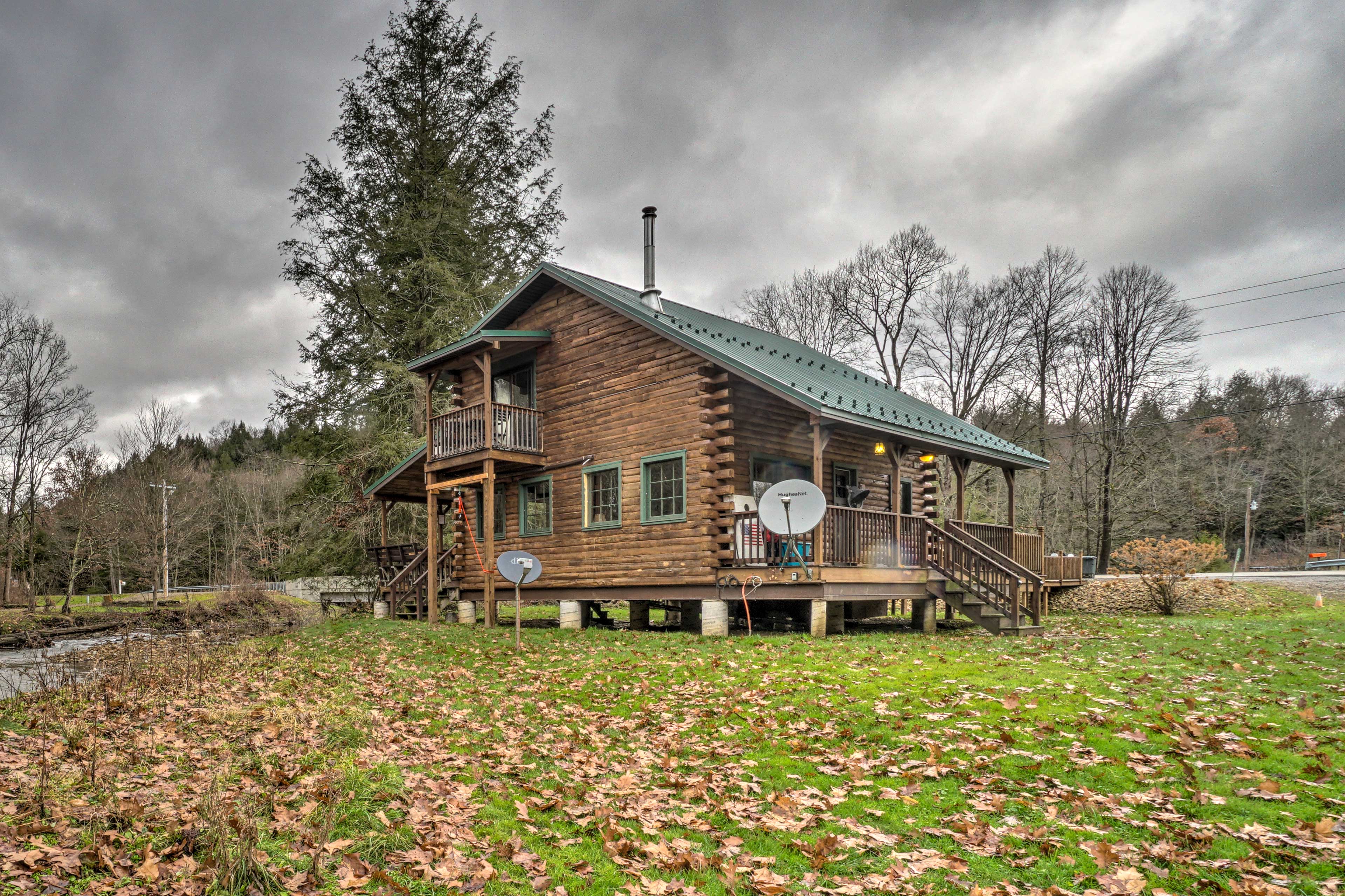 Property Image 2 - Scenic Log Cabin with Fire Pit & Stocked Creek!