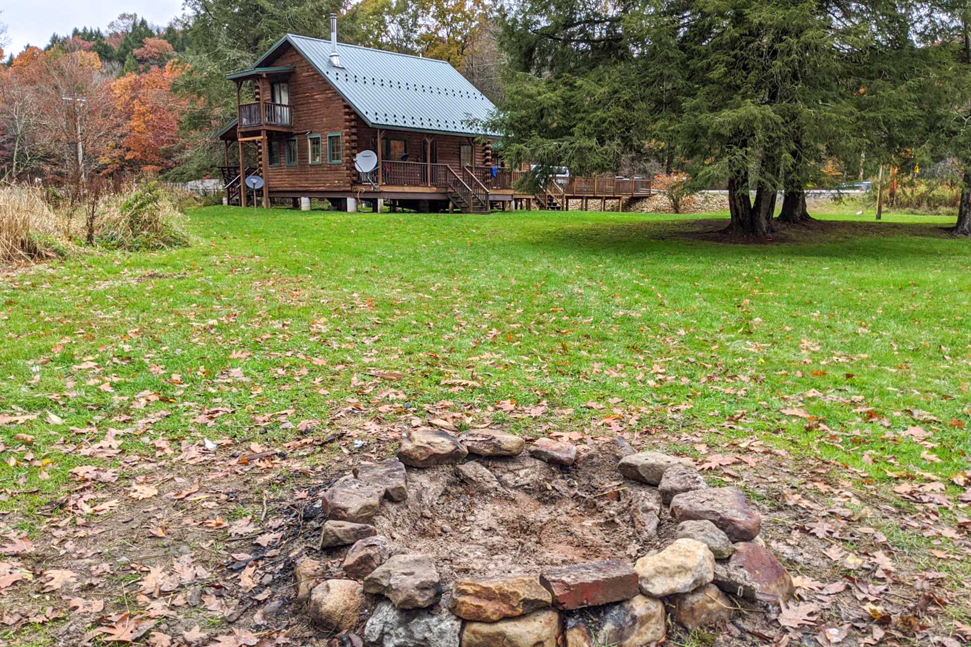 Property Image 1 - Scenic Log Cabin with Fire Pit & Stocked Creek!