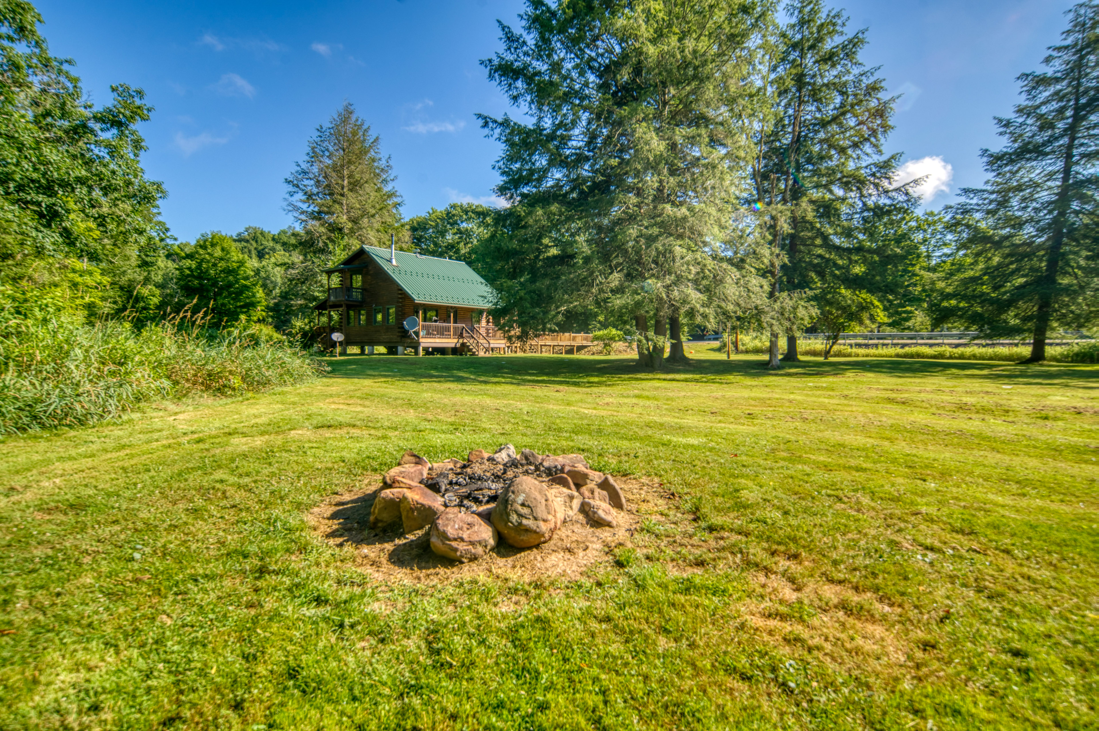 Property Image 2 - Scenic Log Cabin with Fire Pit & Stocked Creek!