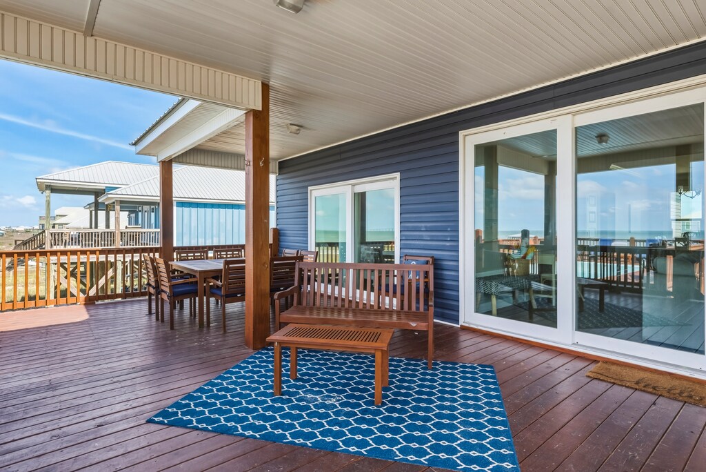 Relax on your private covered deck with comfortable seating and stunning water views stretching to the horizon.