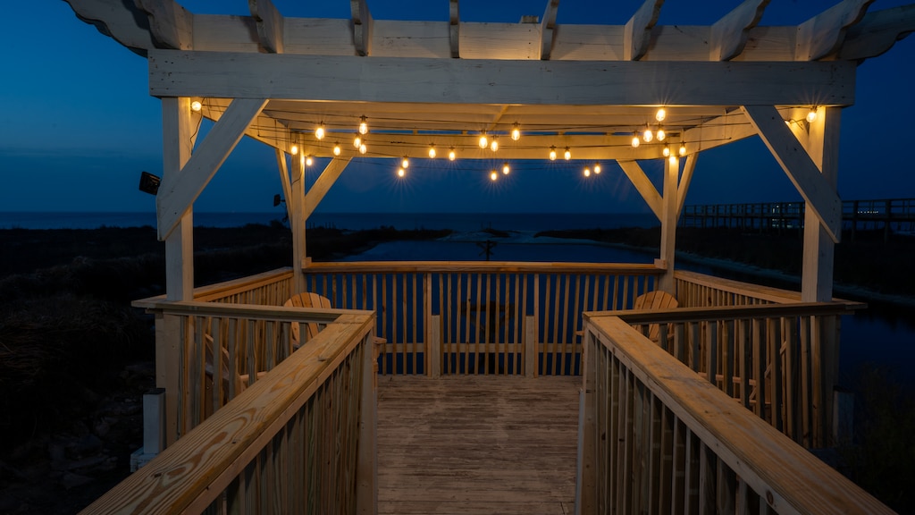 Tidal Wave Pergola with String Lights at Night