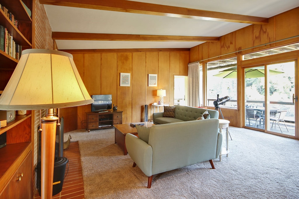 Spacious living room opens to the back deck and dining area.